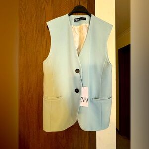 NWT. Never worn. Long light blue vest.